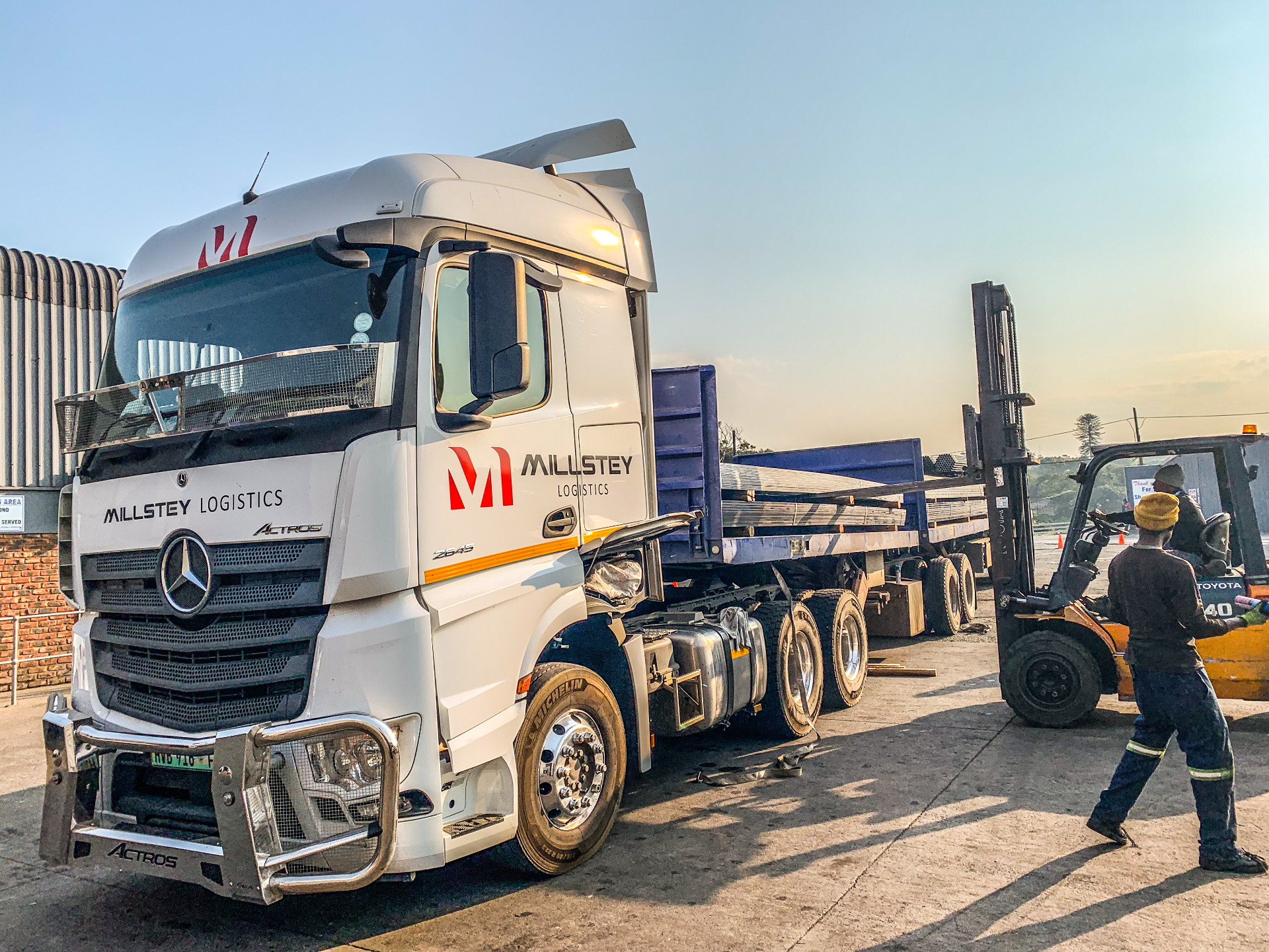 Millstey Logistics truck on a South African highway at sunset